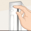 Synkronisering af en wii-fjernbetjening til konsollen