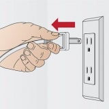 Reparer en tilstoppet papirmakulator