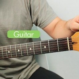 Spiller elektrisk guitar som begynder