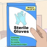 Tager sterile handsker på