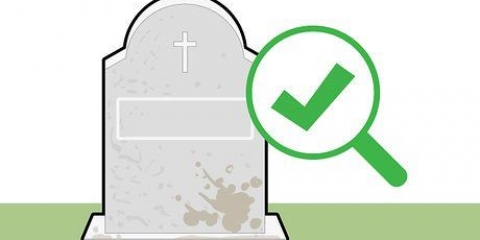 Rengøring af en gravsten
