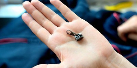Reparer en lynlås, hvis skyder er gået helt af
