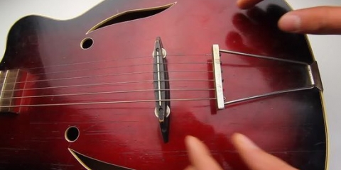 Undgå ømme fingre, når du lærer at spille guitar