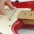 Skift strenge på en elektrisk guitar